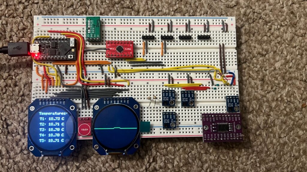 Aeolus breadboard showing temperature readings across two round displays and connected SHT21 sensors