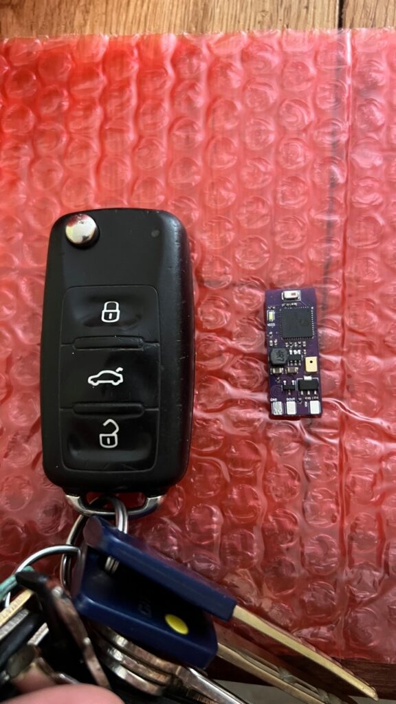 Micro WLED controller next to a car key for scale