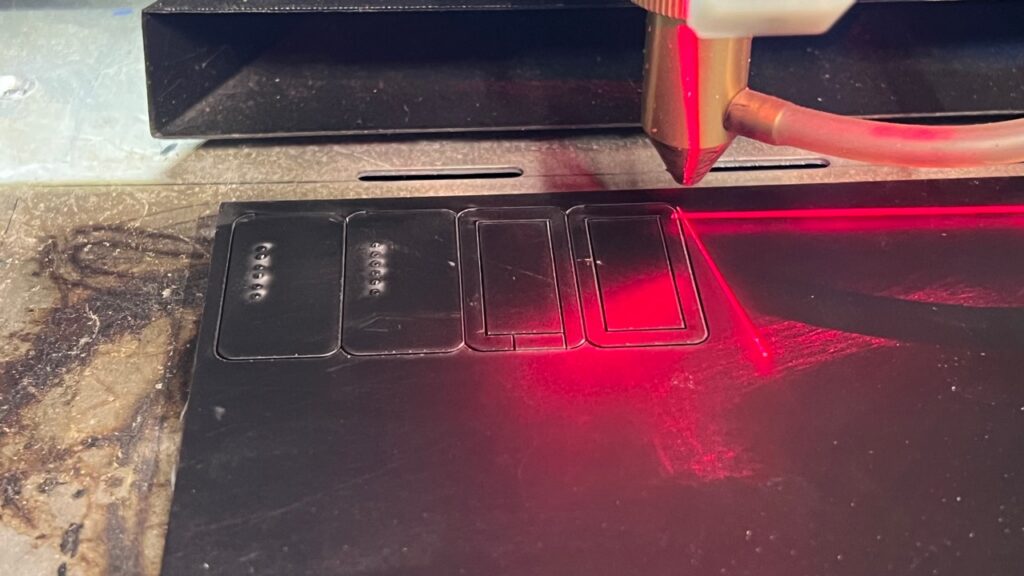 Laser cutting acrylic for the revision-one Micro WLED pogo-pin programming mount